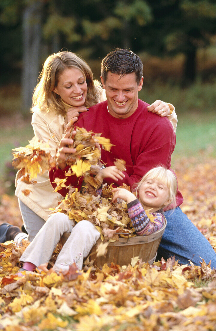 Family and a basket of leaves