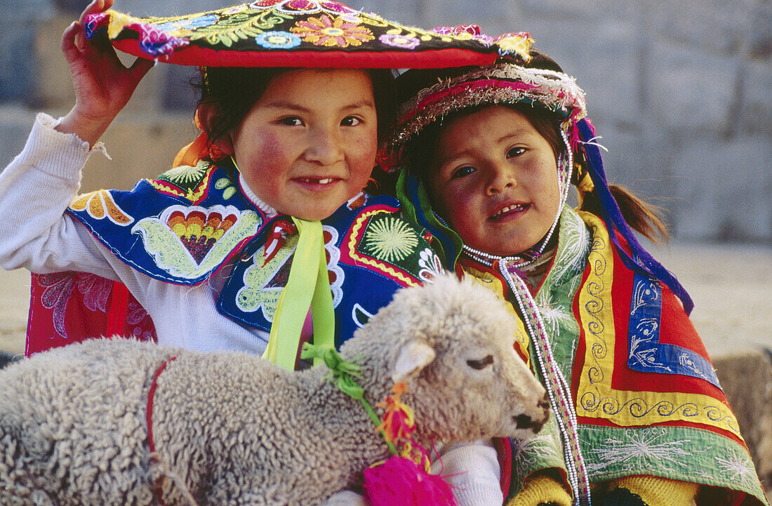 Two children with lamb. Cuzco. Peru