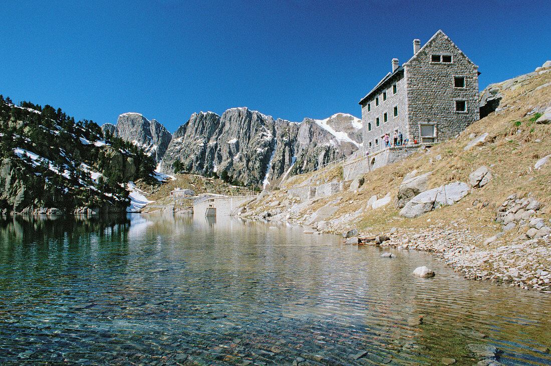 Restanca lake and lodge. Vall d Aran. Pyrenees mountains. Catalonia. Spain.
