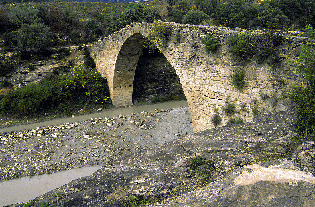 Romanesque bridge. Isabena river. Capella. Isábena valley Ribagorza. Huesca province. Aragon. Spain.