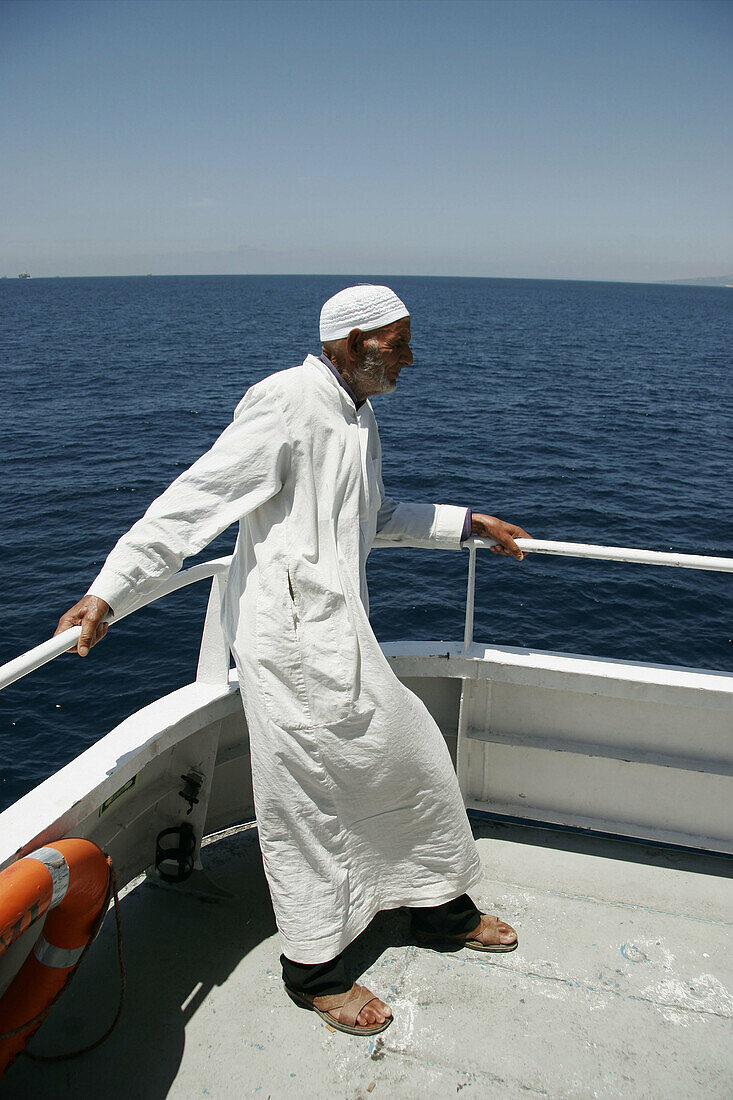 North african man on a ship. Harbour. Tanger. Morocco.