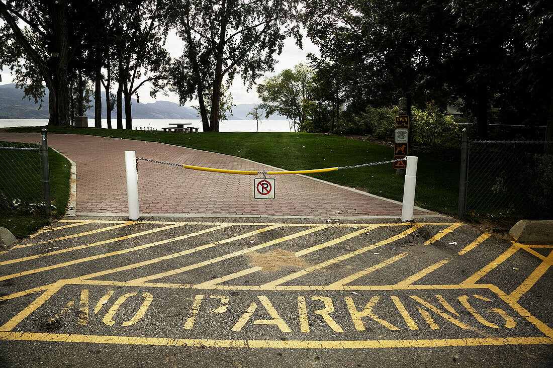 No parking in front of a foot path in a park, British Columbia, Canada.