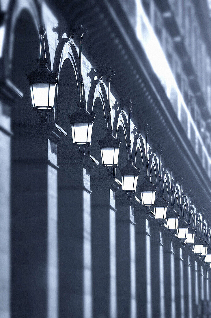 Alignment of square columns and street lights at Rue de Rivoli. Paris. France
