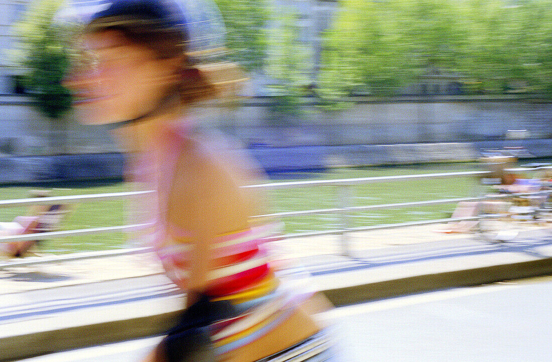 Woman rollerblading near the Seine River. Paris. France