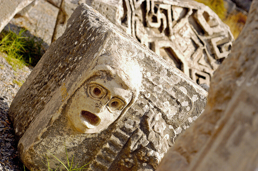 Carved face in the stones of the Roman ruins of Ephesus. Turkey