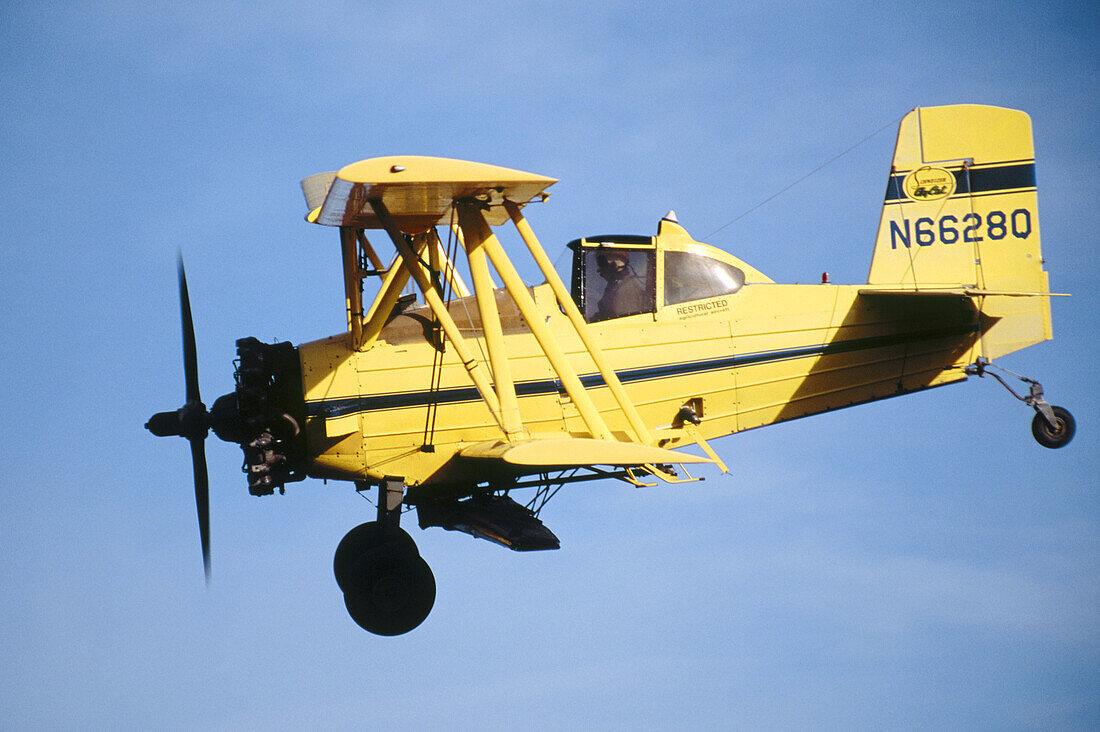 Crop duster airplane right after take-off at an airstrip just North of Oaksdale. Withman County, Washington, USA