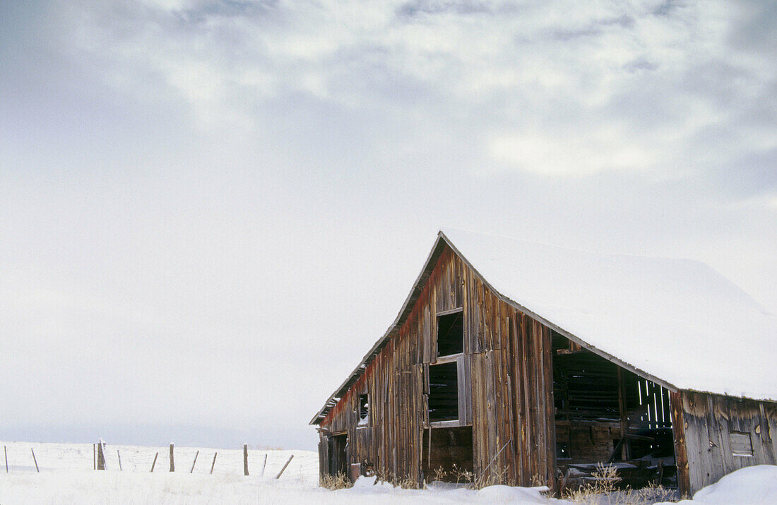 Old barn with snow in Northeast Oregon. Grant County, Oregon, USA