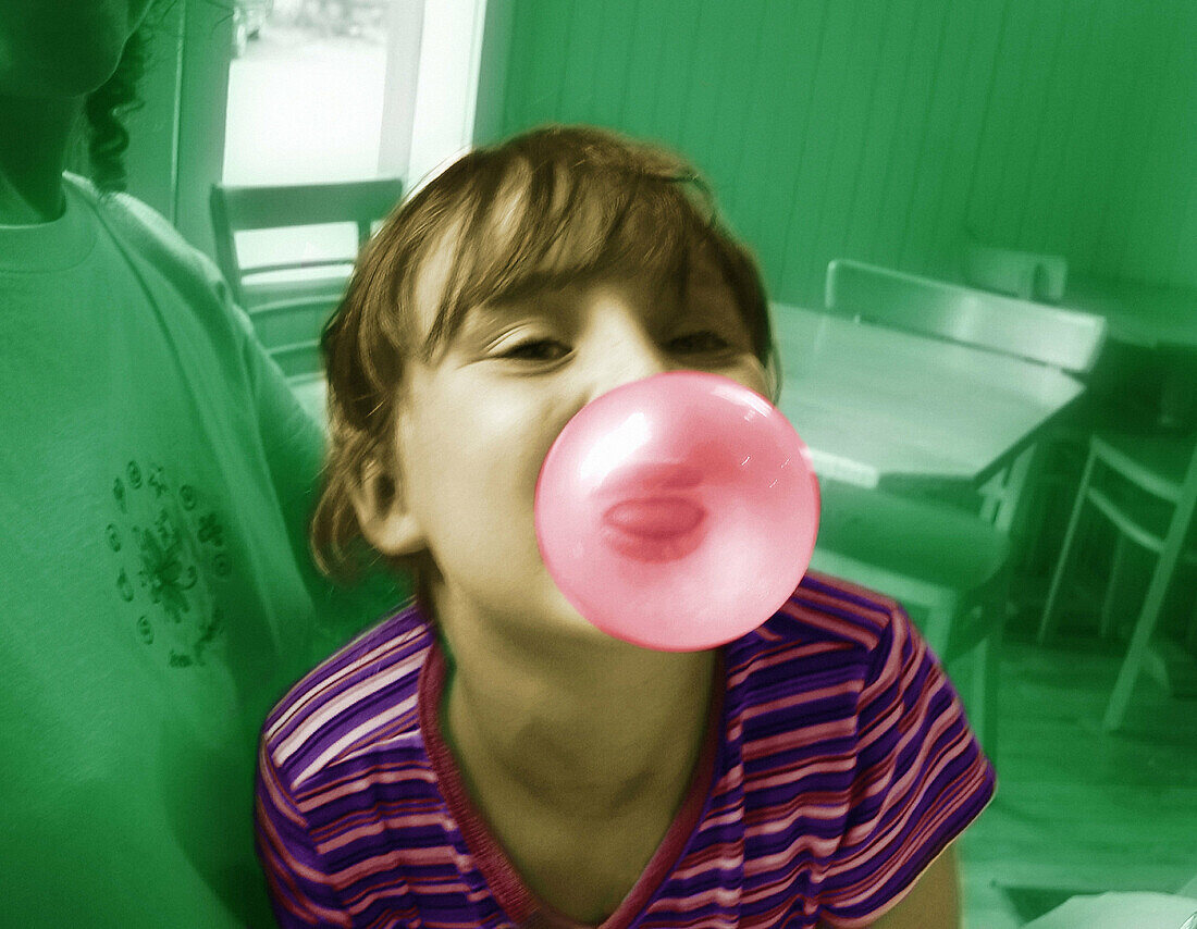 Girl blowing big bubble