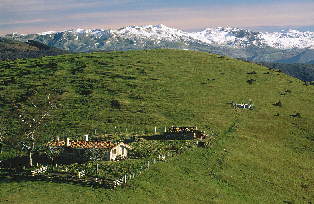 Sheepfold with Sierra de Aralar in background. Sierra de Aizkorri. Gipuzkoa. Basque Country. Spain