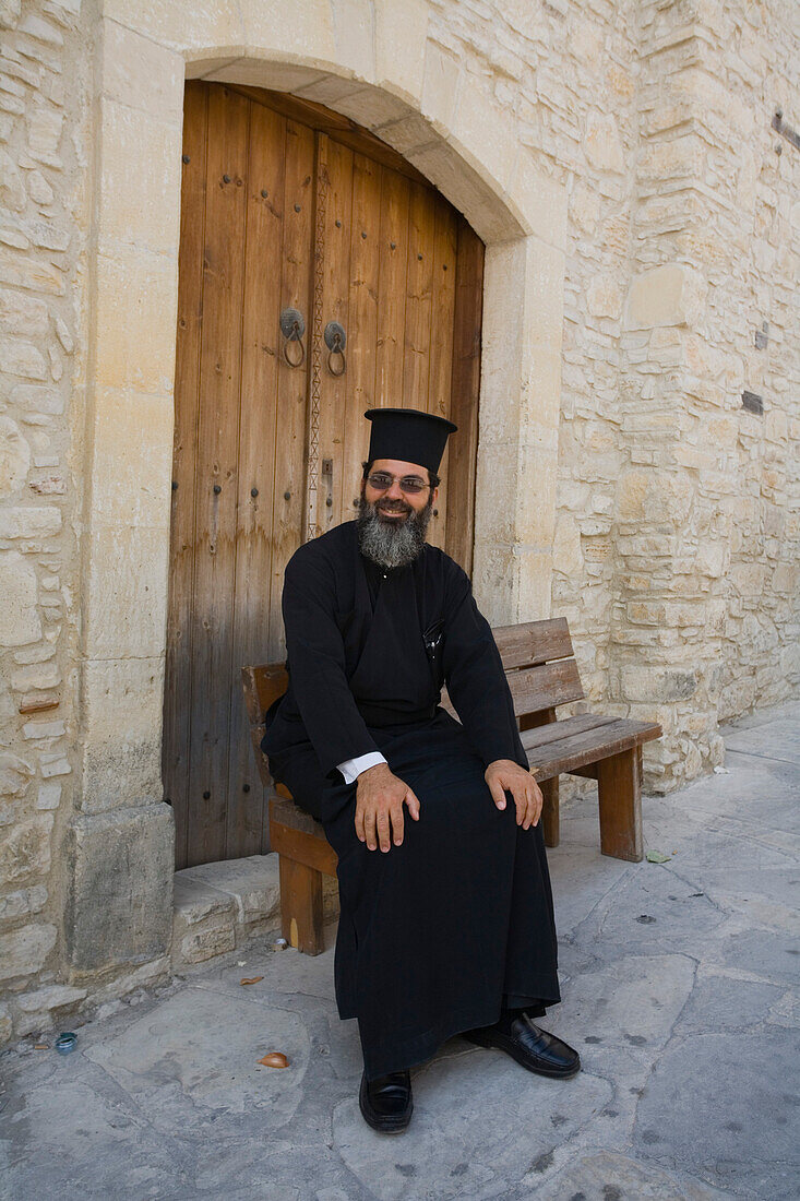 Father Neofytos an Orthodox priest, in front of a monastery, Omodos, Troodos mountains, Cyprus