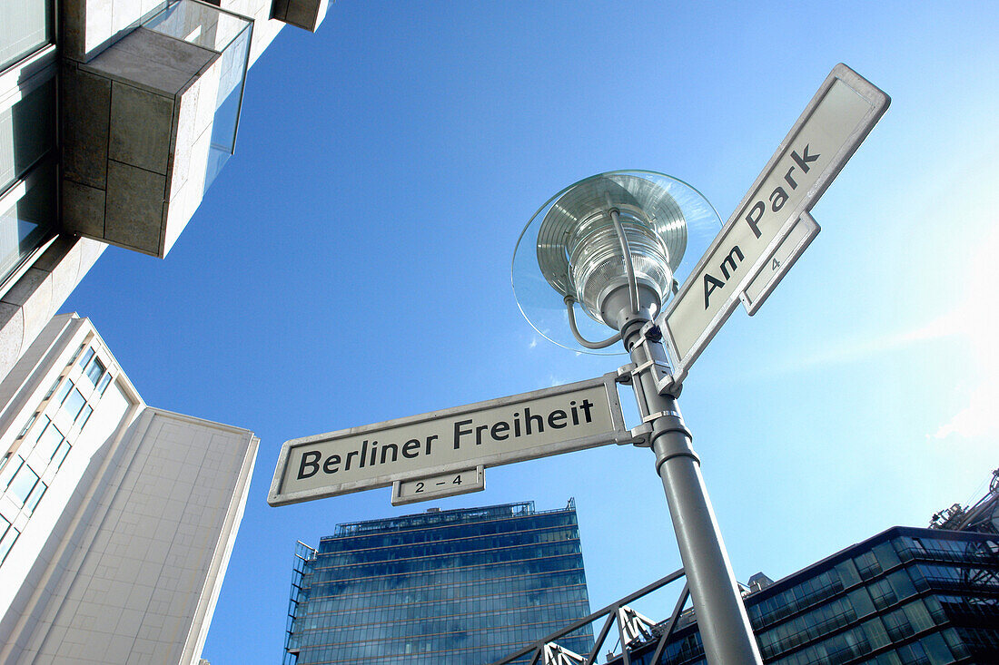 Street lamp with street name signs, Berlin, Germany