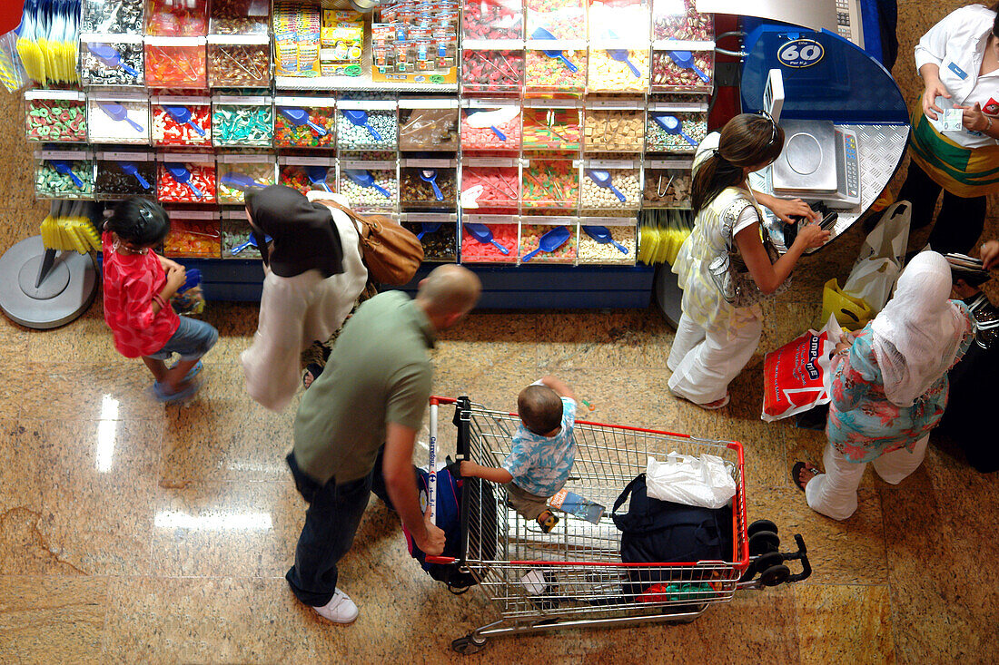 People buying sweets at shopping center, Mall of the Emirates, United Arab Emirates, UAE