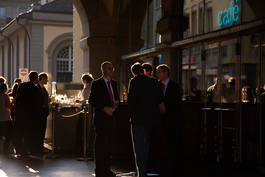 People enjoying a beer at a cafe bar, Kornhaus, Old City of Berne, Berne, Switzerland