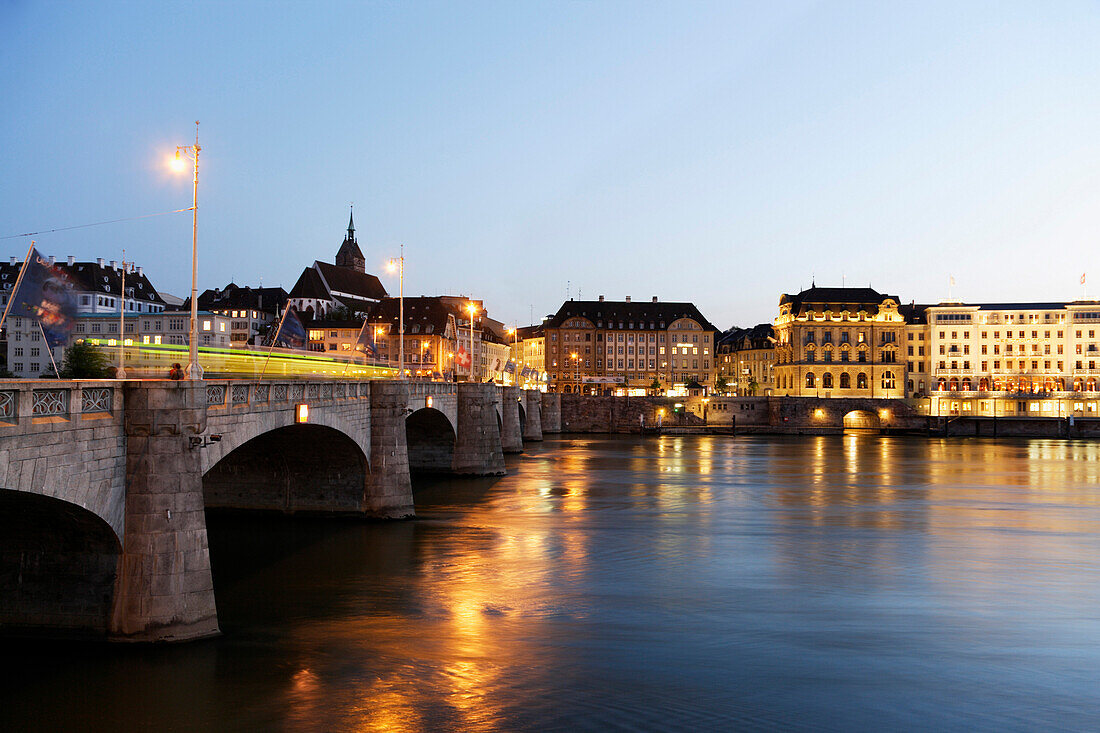 Evening view of a bridge, Mittlere Rheinbruecke, and Church, Martinskirche, Basel, Switzerland