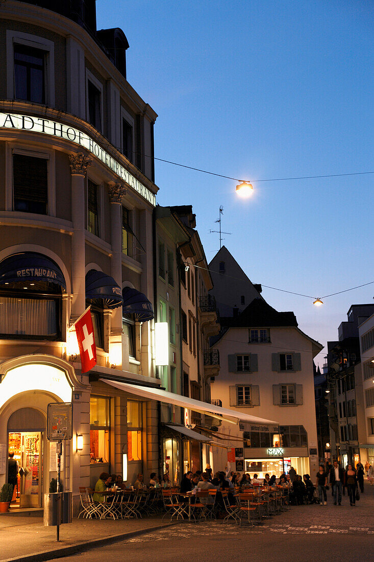 People sitting in a cafe in the evening light, Barfuesserplatz, Gerbergasse, Basel, Switzerland
