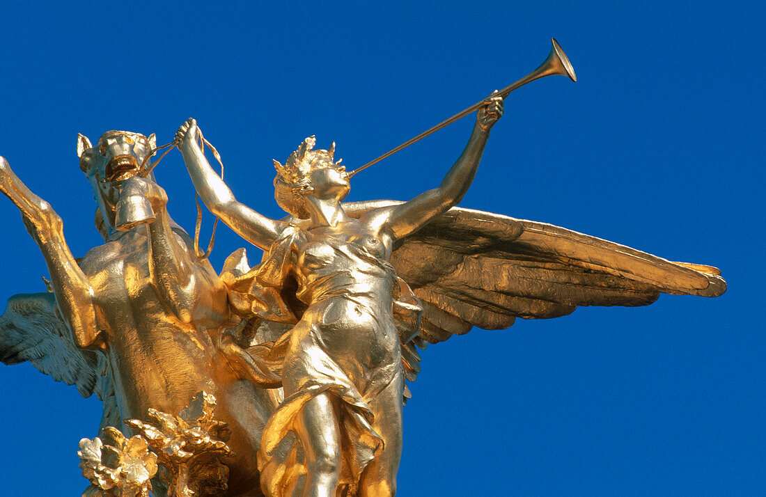 Statues at Alexandre III Bridge. Paris. France.