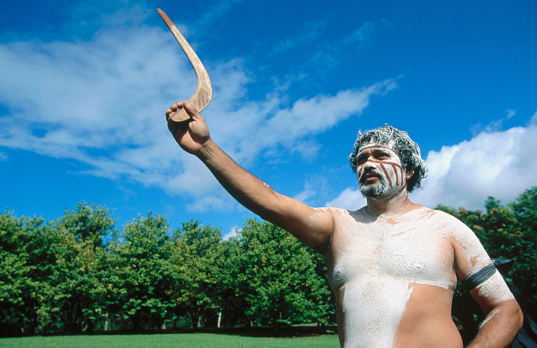 Aborigene with boomerang in Cairns. Queensland. Australia