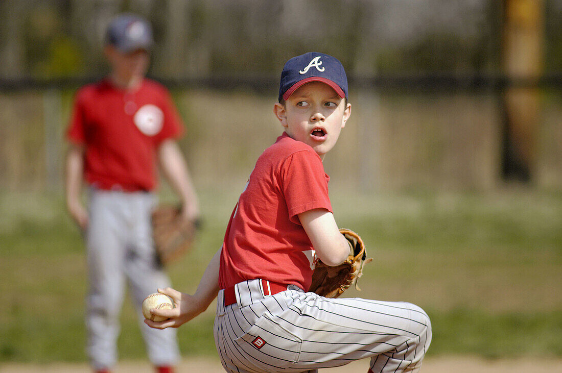 Little league baseball game, with full safety gear, all boys aged from 5 to 9, in Atlanta. Georgia. USA.