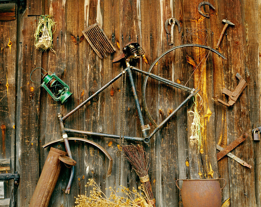 Metal junk on a wooden barn wall