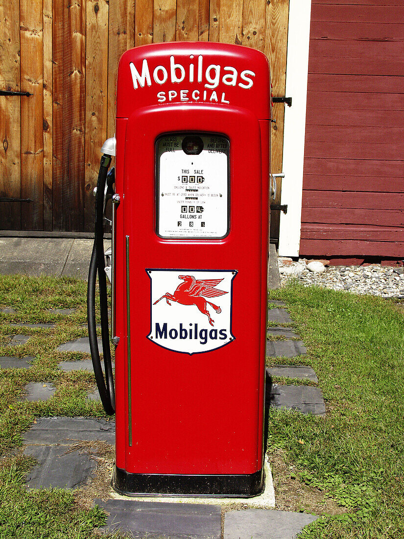 Gas pump in yard in Shelburne Falls. Massachusetts, USA