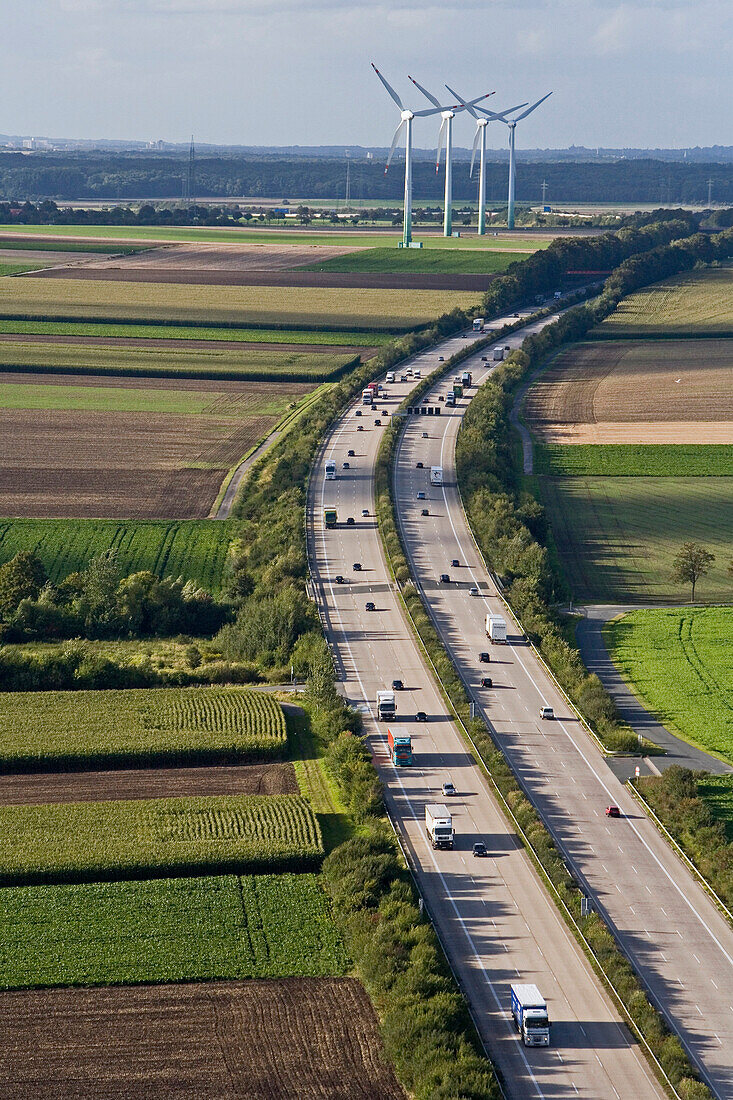 Aerial of the expressway A7, wind turbines in background, Lower Saxony, Germany