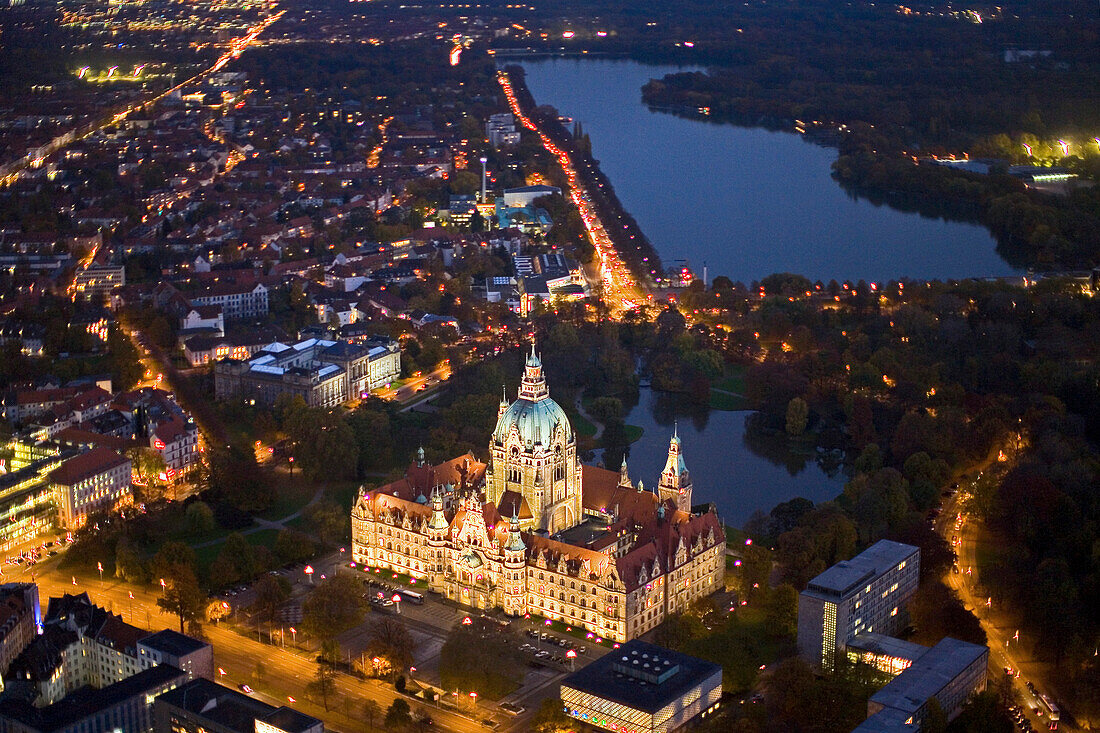 Aerial shot of New Town Hall and lake Maschsee at night, Hanover, Lower Saxony, Germany