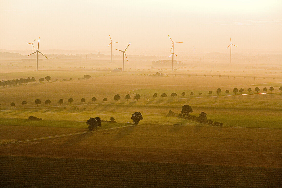 aerial of wind turbines in evening light, Lower Saxony, northern Germany