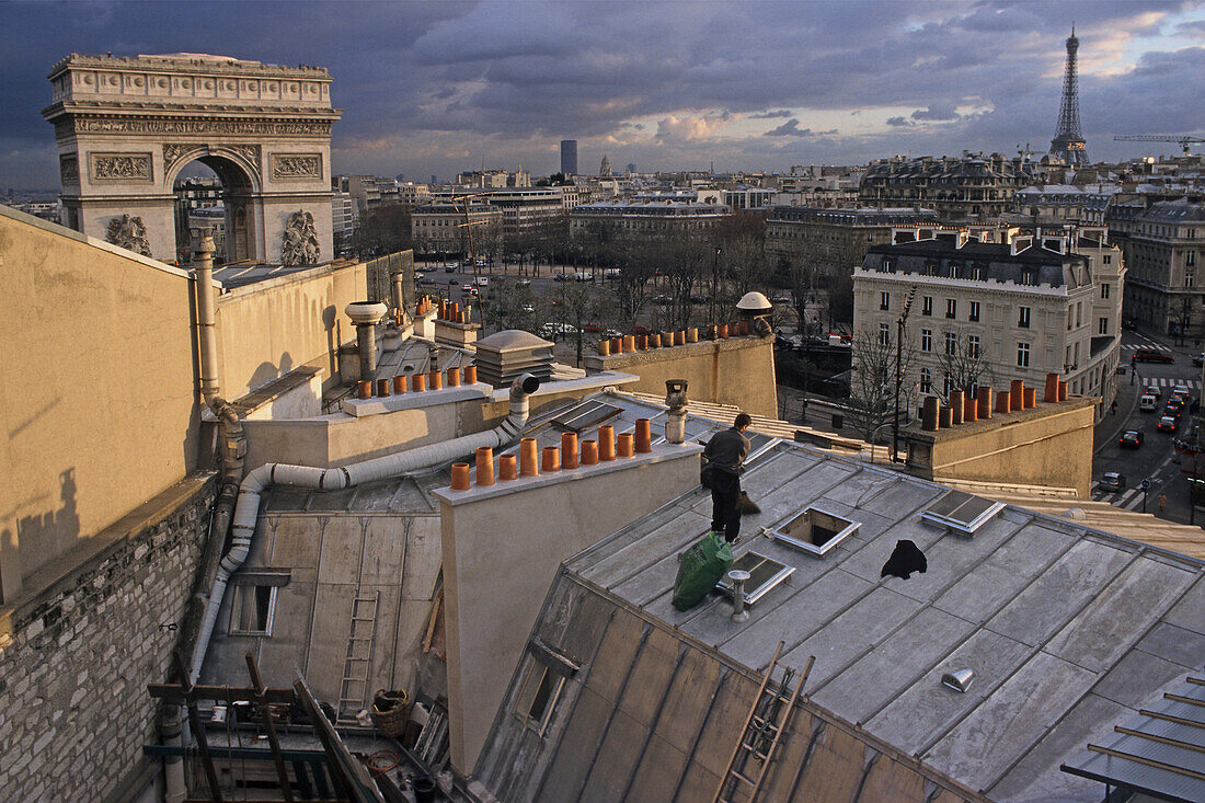 View of roofs and Arch of Triumph in the evening, Place de l'Etoile, Paris, France, Europe