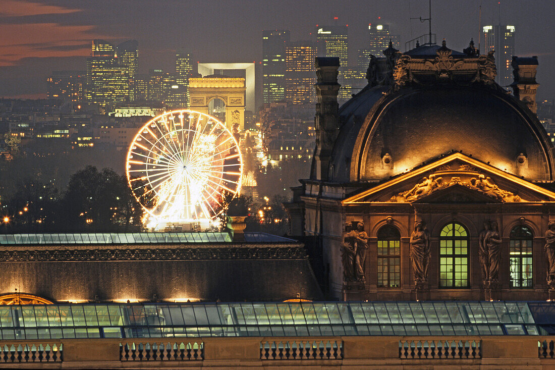 View from the department store La Samaritaine towards the Louvre, Arc de Triomphe and Grande Arche La Defense, illumated at night, historical axis, Paris, France