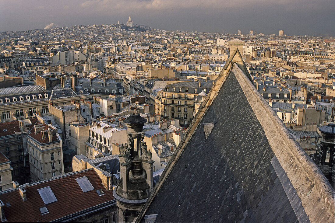 View from the roof of Eglise Saint Eustache church over roofs of in evening sun, skyline, 1e Arrondissement, Paris, France, Europe