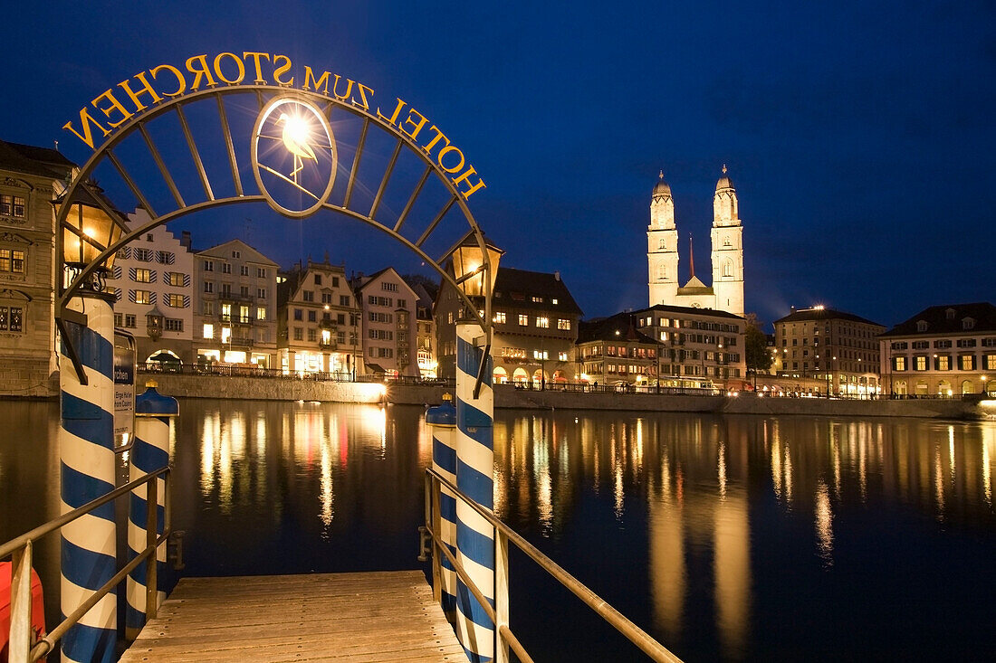 Switzerland, Zurich, old town center, river Limmat at night, Limmatquai Grossmunster, Pier Hotel Storchen