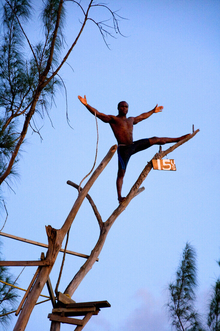 Jamaica Negril Ricks Cafe Cliff Diver jumping from a Tree