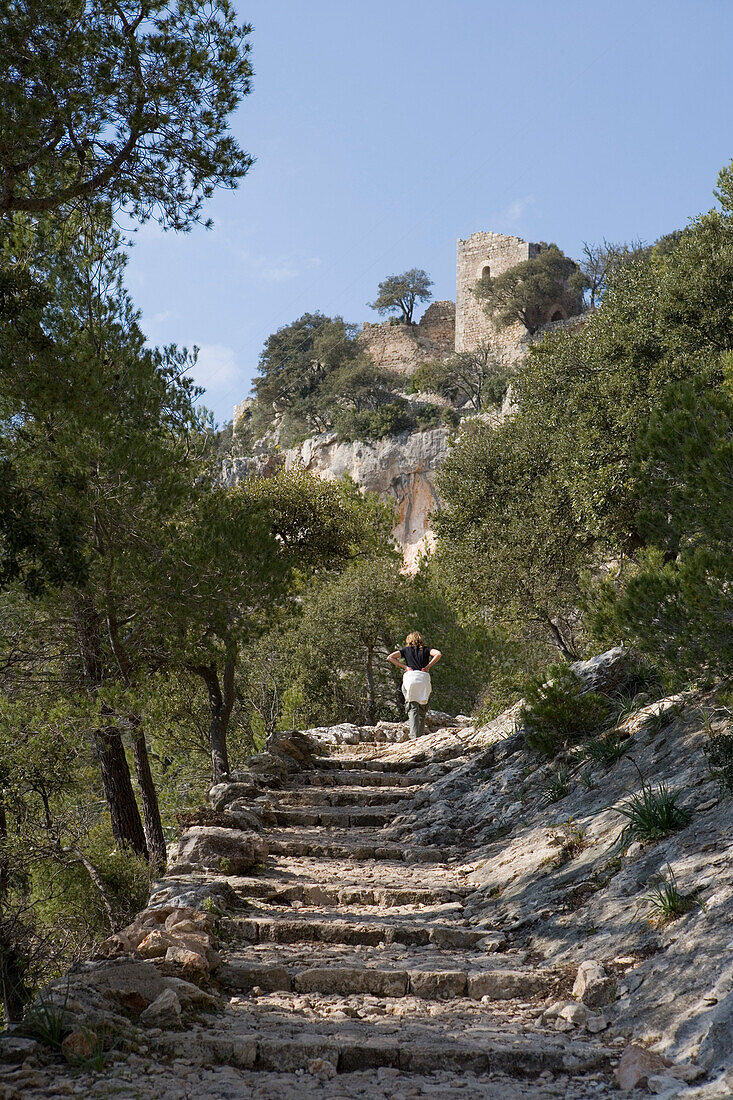 Hiker on Path to Castell d'Alaro Castle, Alaro, Mallorca, Balearic Islands, Spain