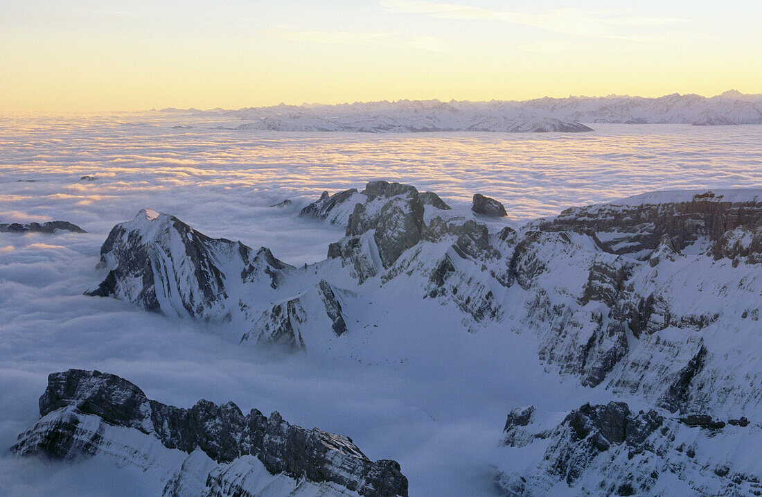 Eastern Alps with fog at sunrise. View from the Saentis. Appenzell. Switzerland.