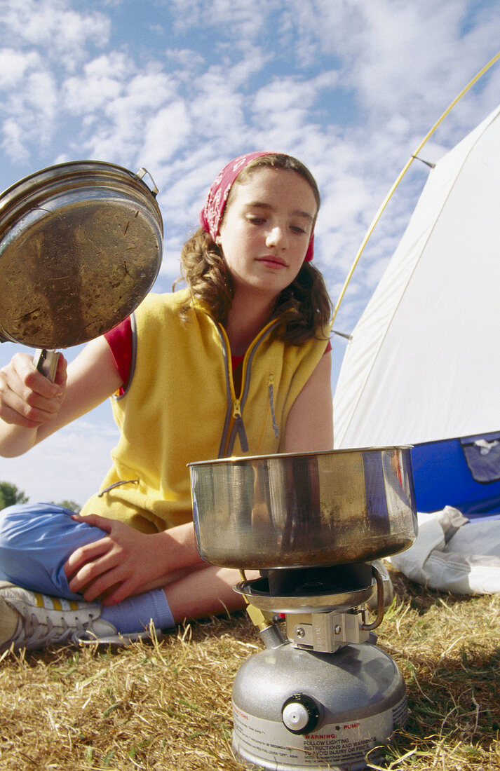 Girl with camp stove.