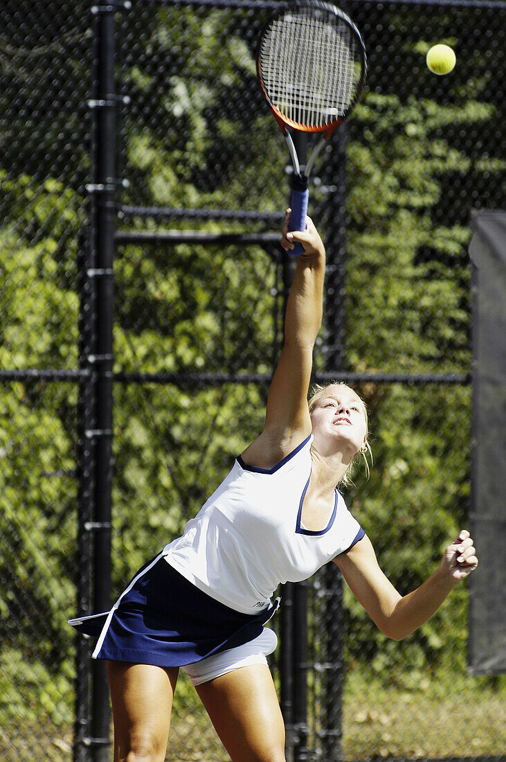 Female doubles high school tennis match
