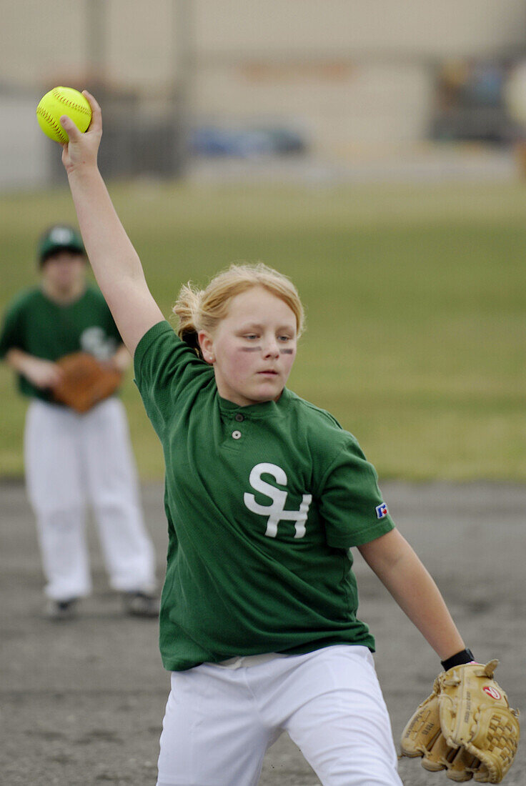 Young girls play softball