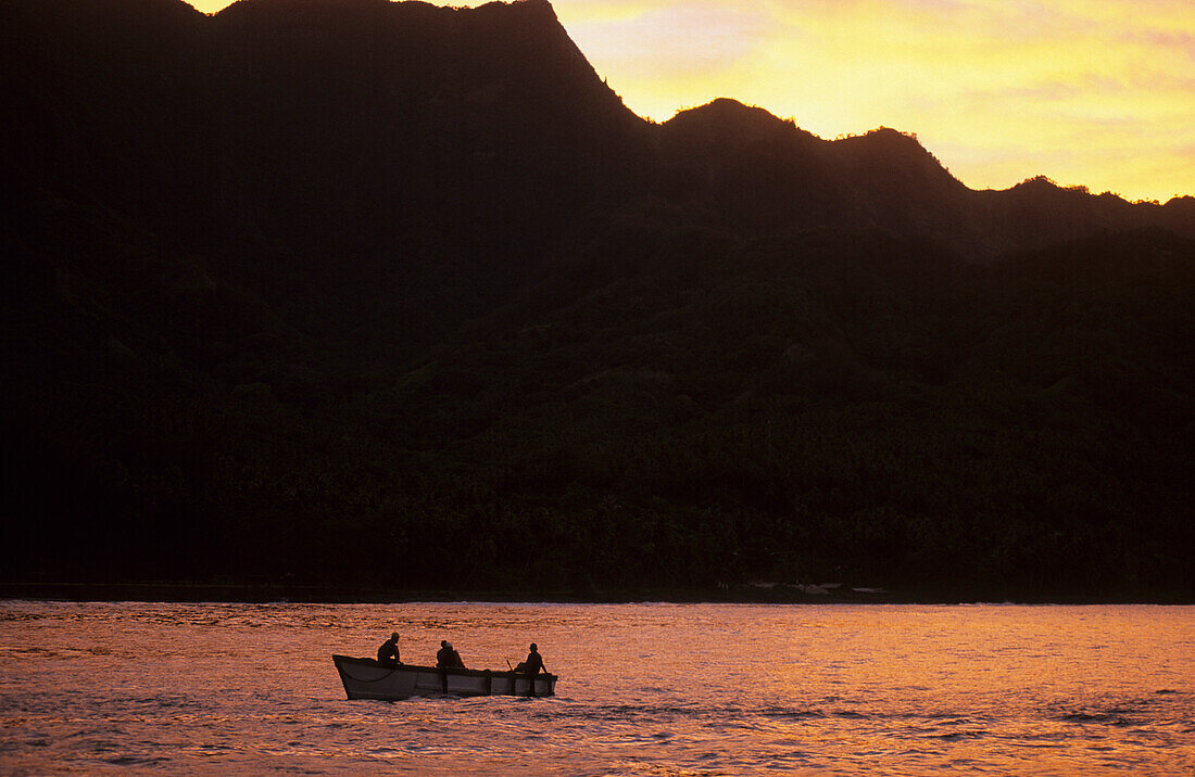 People in a dinghy of the Aranui III off Hatiheu on the island of Nuku Hiva, French Polynesia