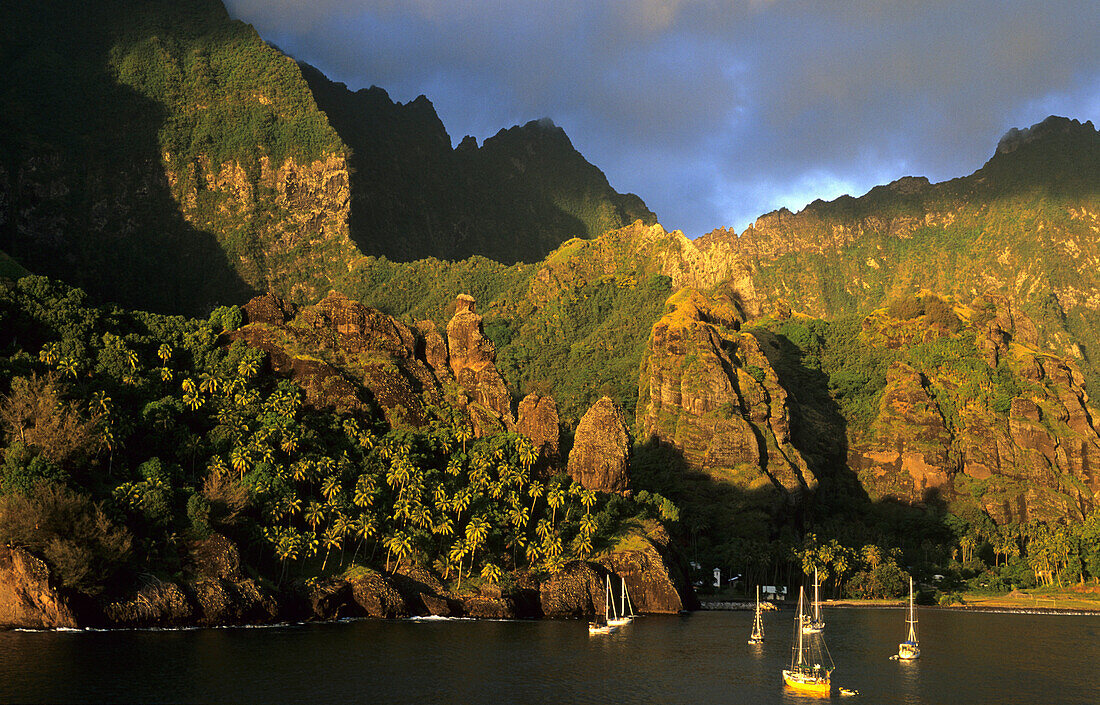 Boats anchoring in the Bay of Hanavave on the island of Fatu Iva, French Polynesia