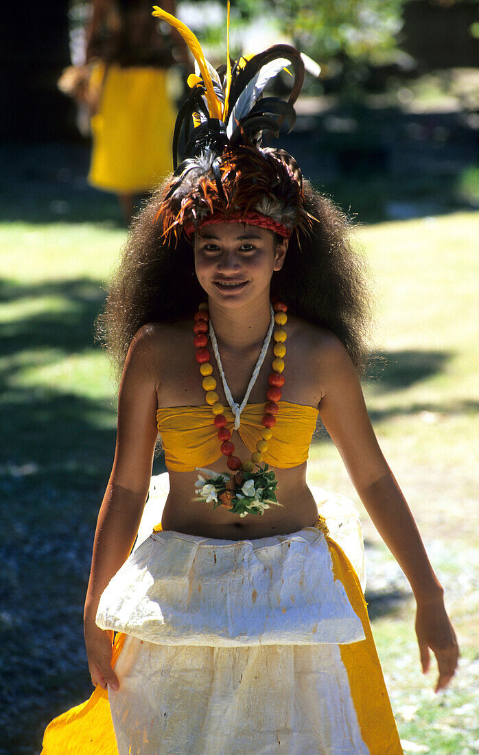 Young woman in traditional dress, dance of welcome in the village of Hakahau on the Island of Ua Pou, French Polynesia