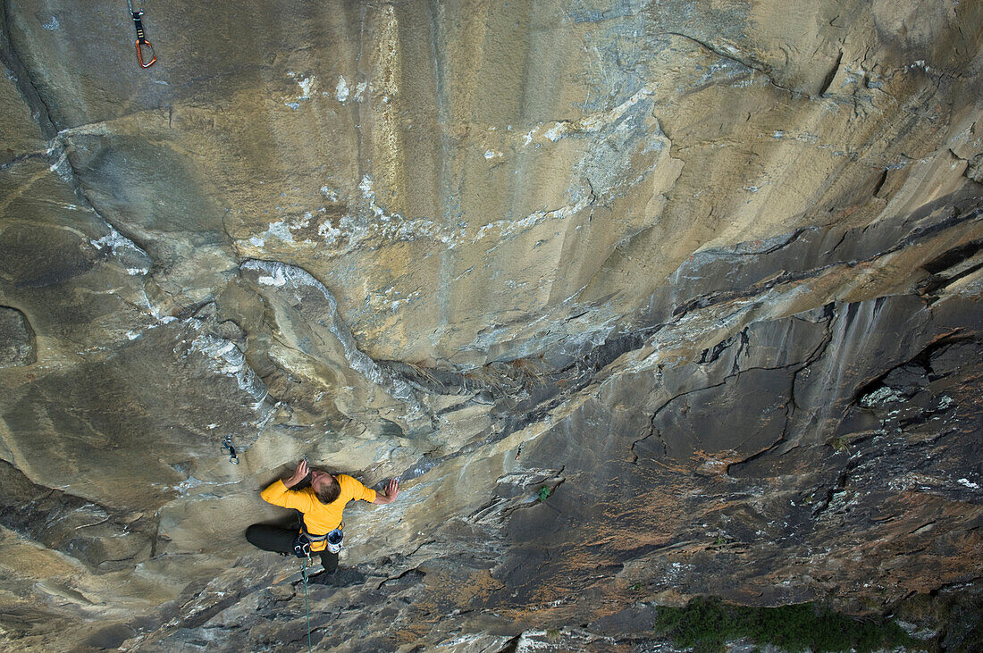 Free climber scaling rock face, Malta Valley, Hohe Tauern National Park, Carinthia, Austria