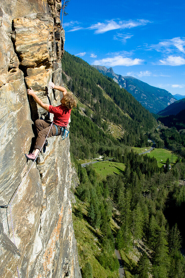 Man rock climbing in Maltatal, View into the valley, Tauern National Park, Carinthia, Austria