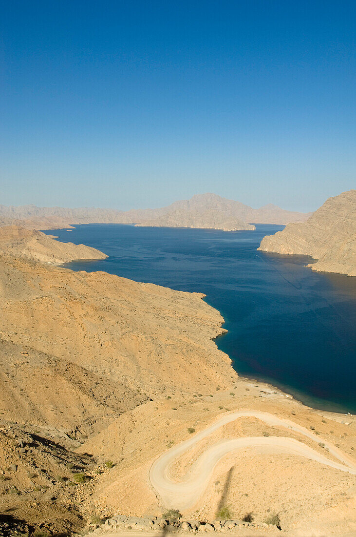 Fjord in the Haijar Mountains with mountain road, Kashab, Khasab, Musandam, Oman