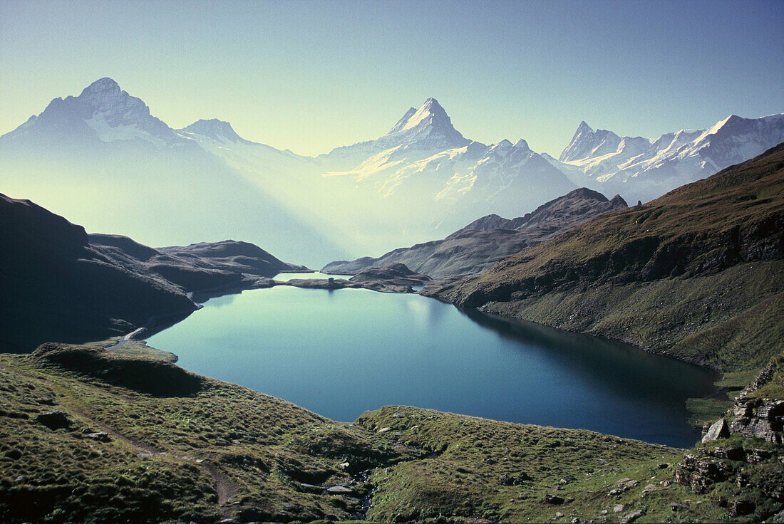 Hiking at Bachalpsee lake with Schreckhorn and Eiger, over Grindelwald, Bernese Oberland, Switzerland