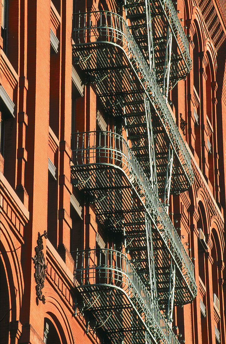 Fire escape on building in Soho. New York City, USA