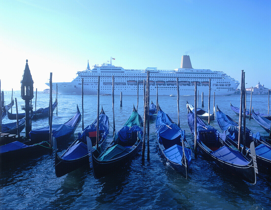 Gondolas and cruise ship, Venice. Veneto, Italy