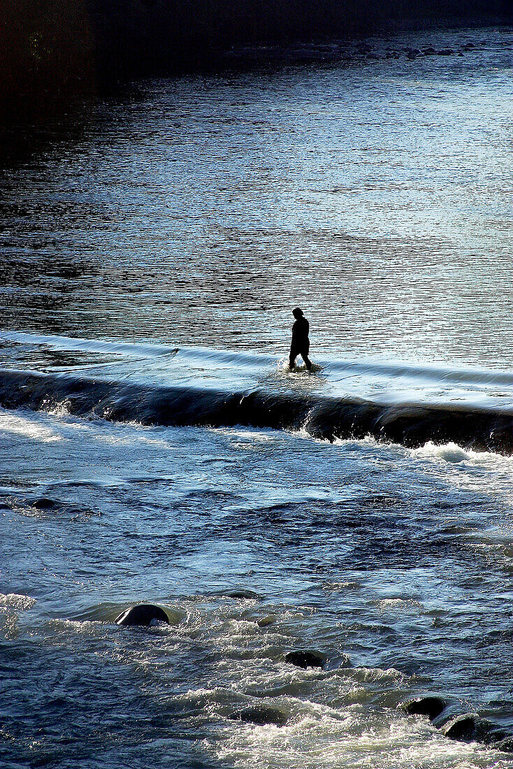 Woman crossing river. Tabasco, Mexico