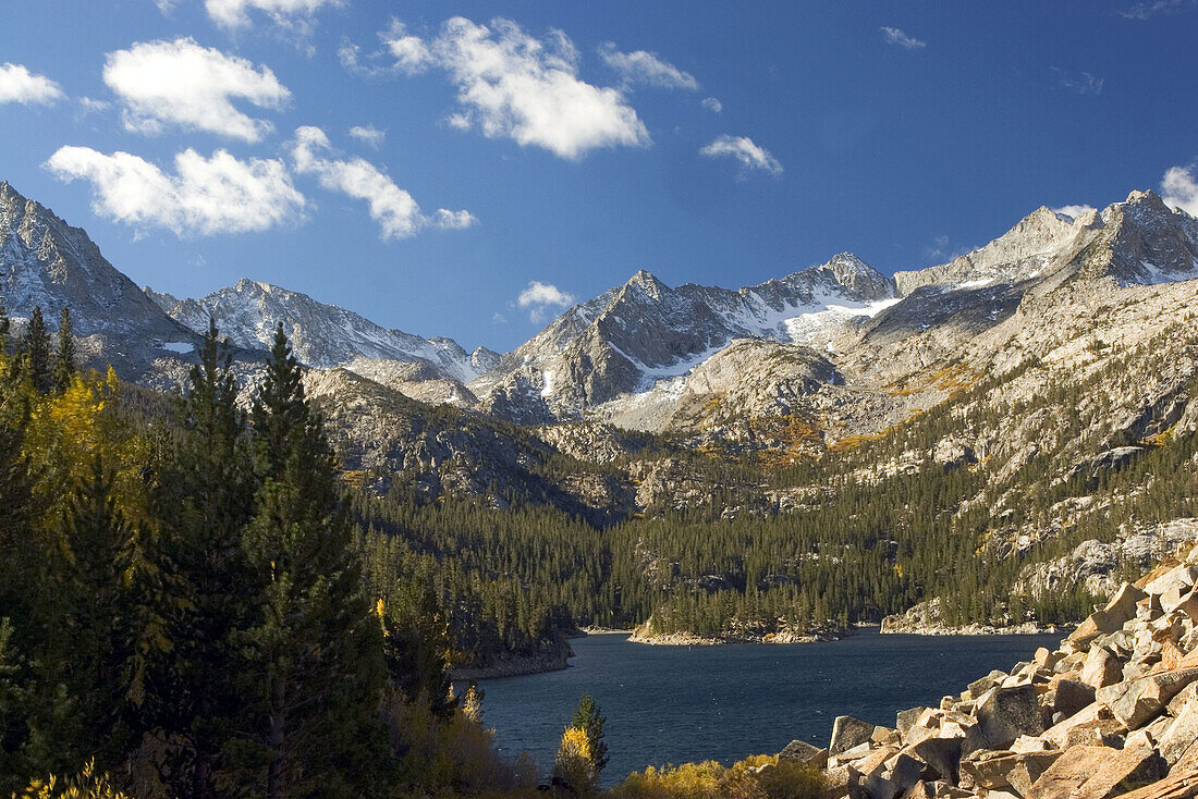 South Lake in the fall with Aspens in fall colors and snow cap peaks in the background near Bishop, California