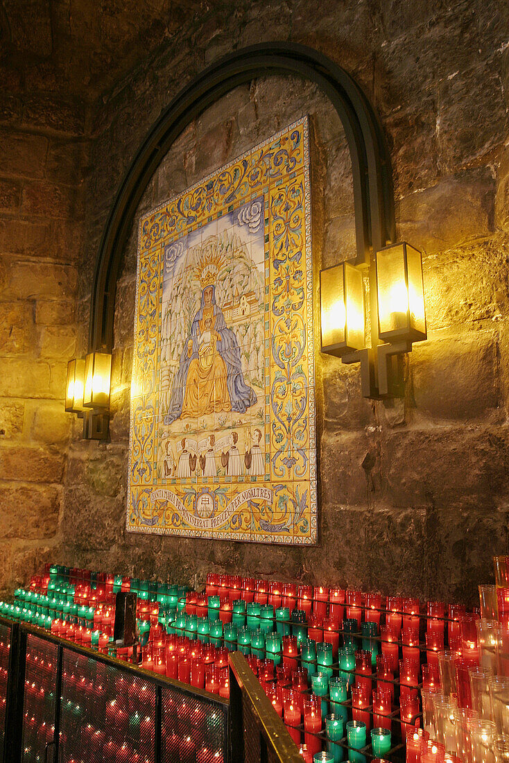 Candle offerings in Montserrat benedictine abbey. Barcelona province, Catalonia, Spain