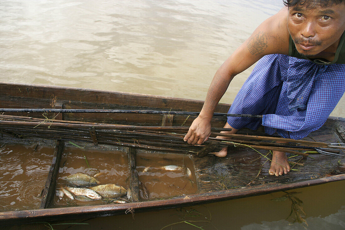 Intha fisherman showing captures on the Inle Lake. Shan state. Myanmar (Burma).